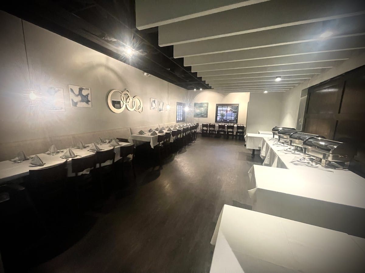 A large room with a lot of tables and chairs in it