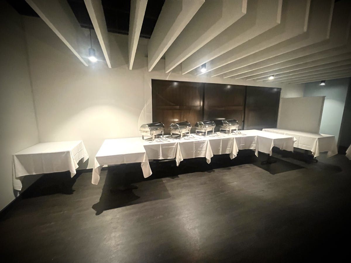 There are many tables and buffets in the room.