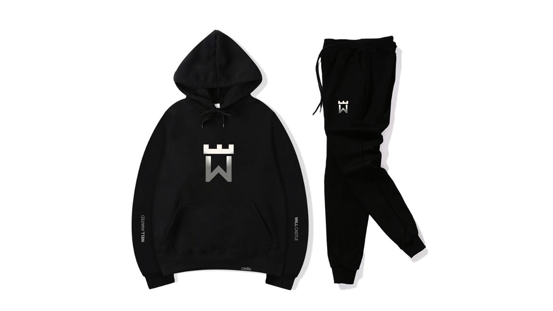 A black hoodie and pants are sitting on a white surface.