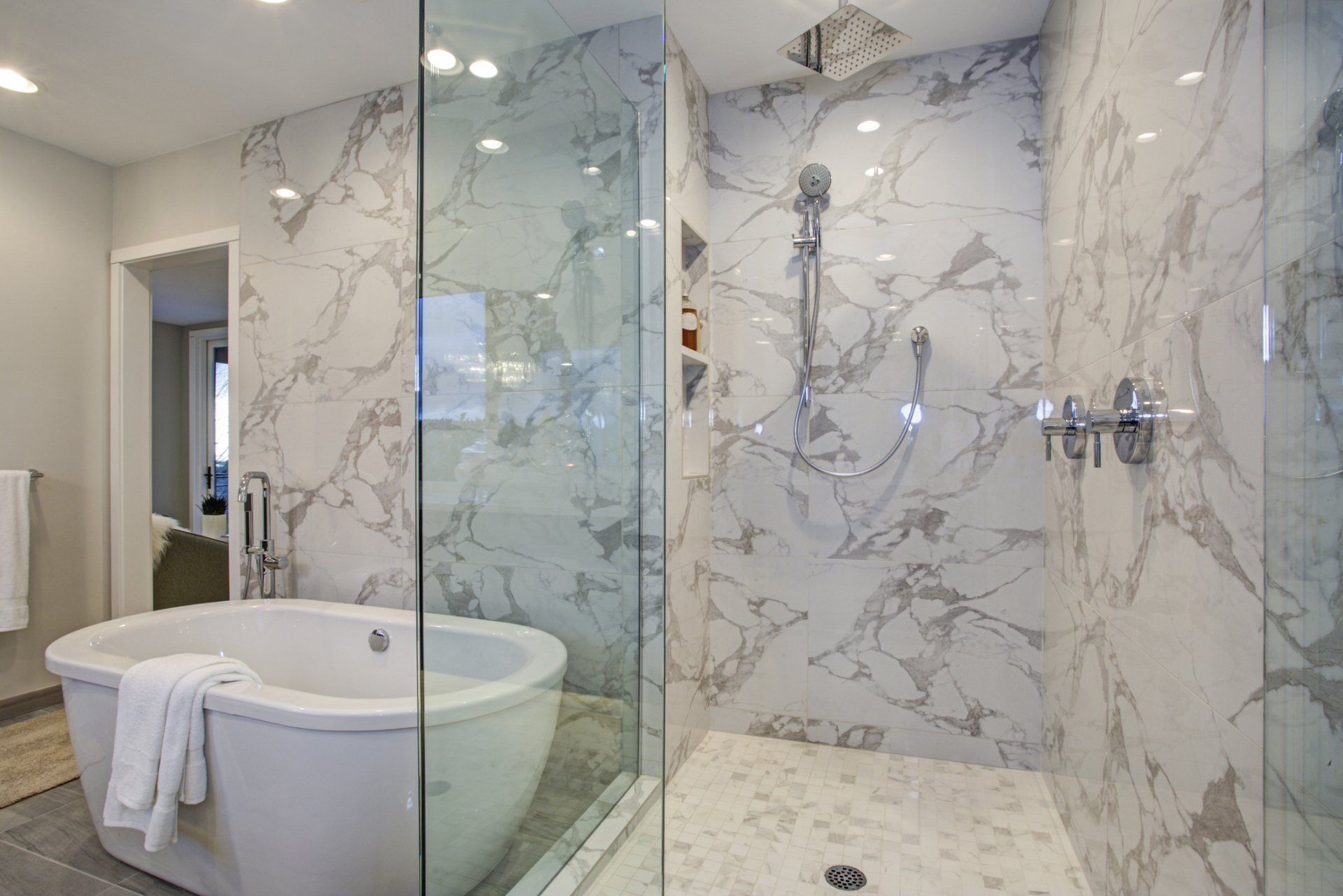 marble bathroom with glass enclosure