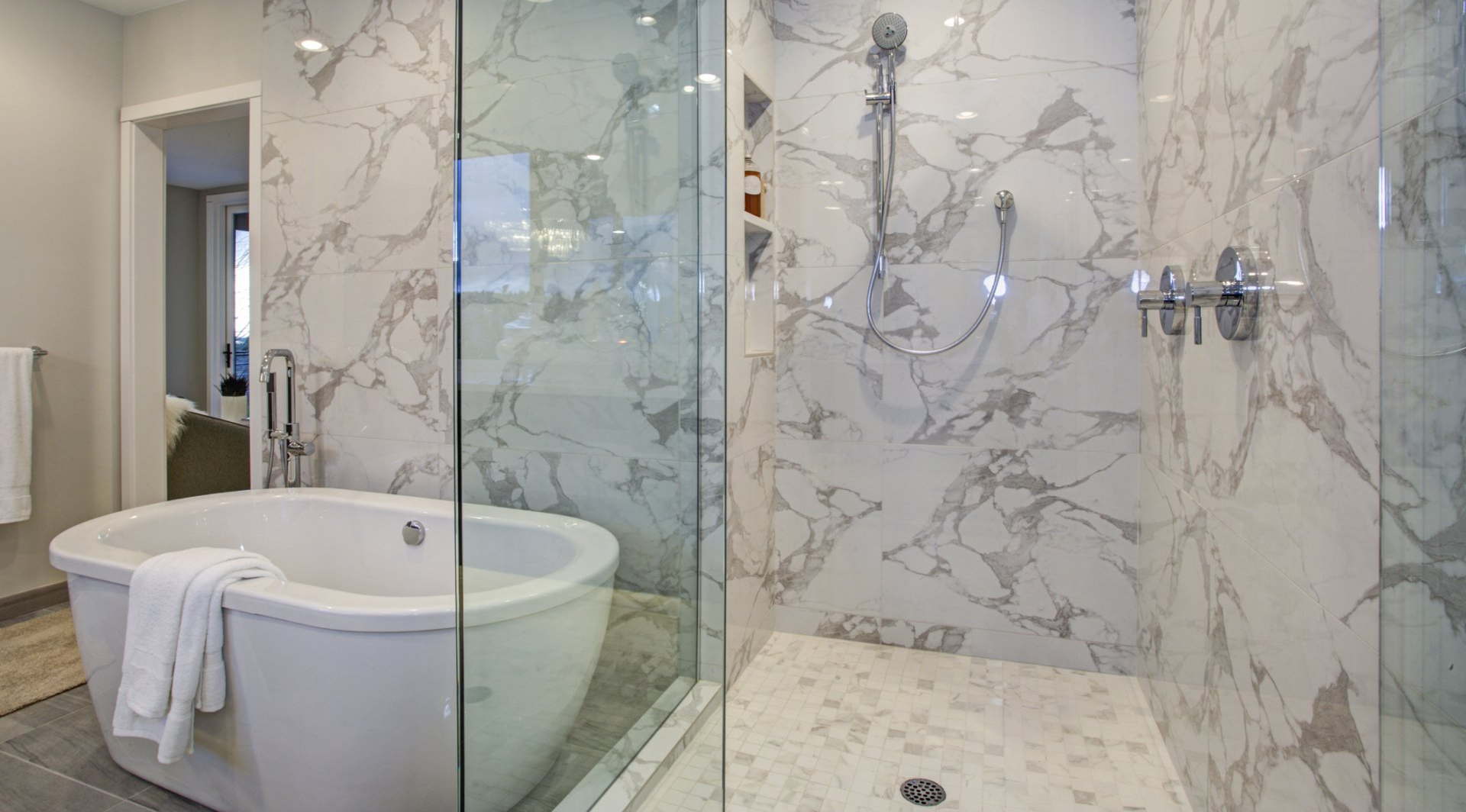 tub with frameless design shower enclosure