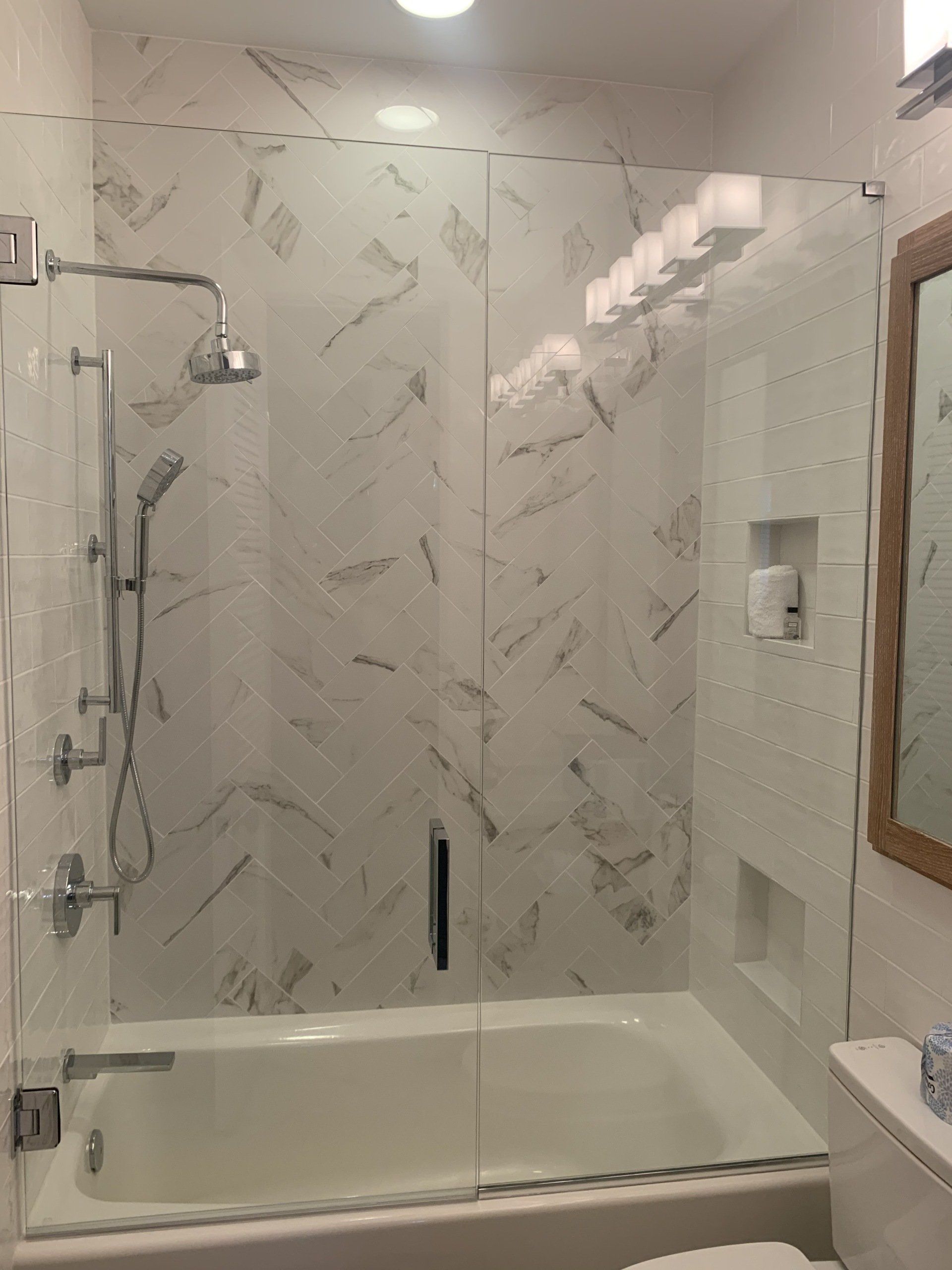 bathroom remodel with frameless design shower door in glass and chrome