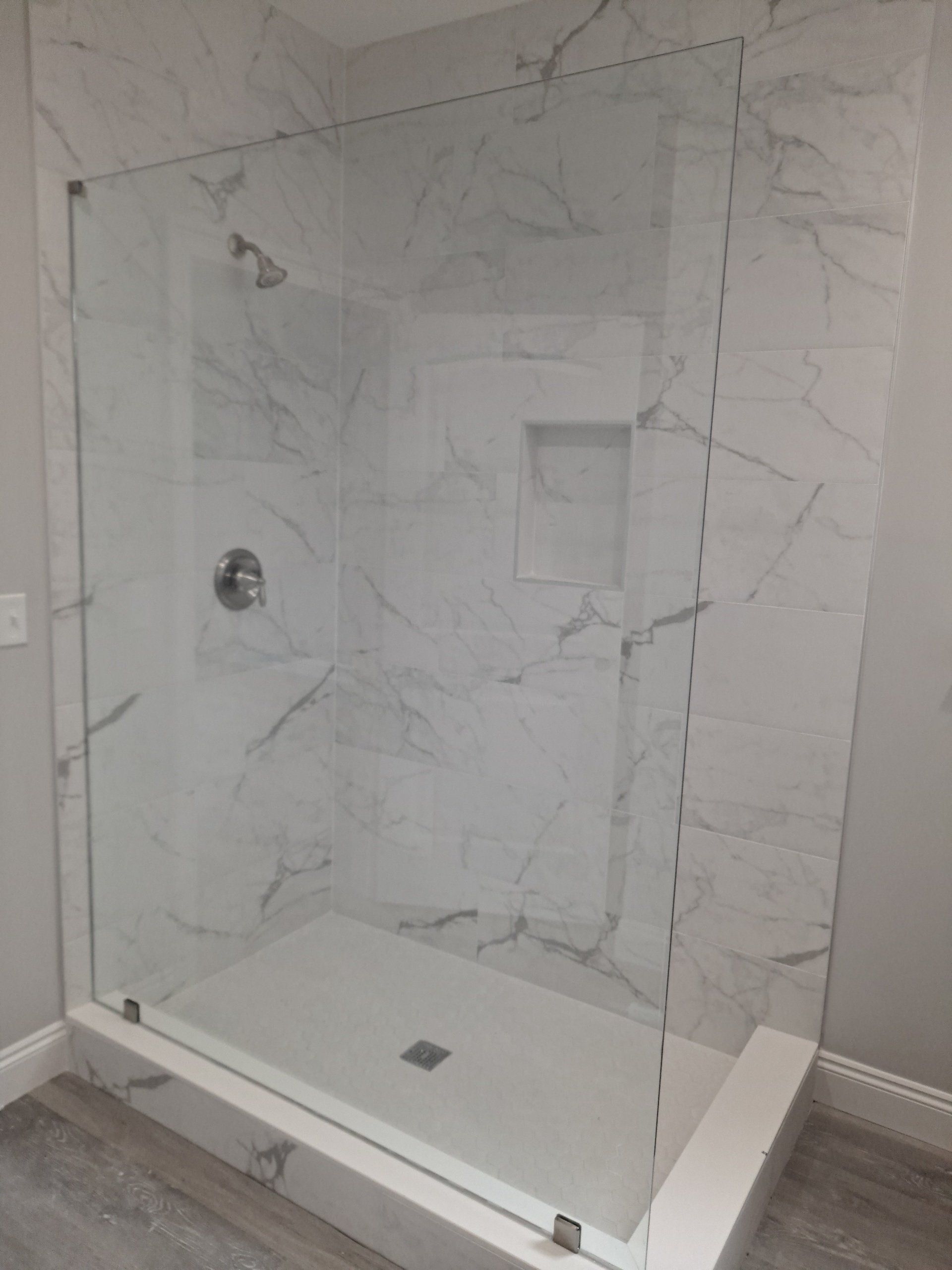 closeup of a shower with glass doors