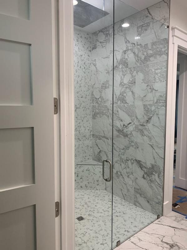 frameless design showers with a modern bathroom