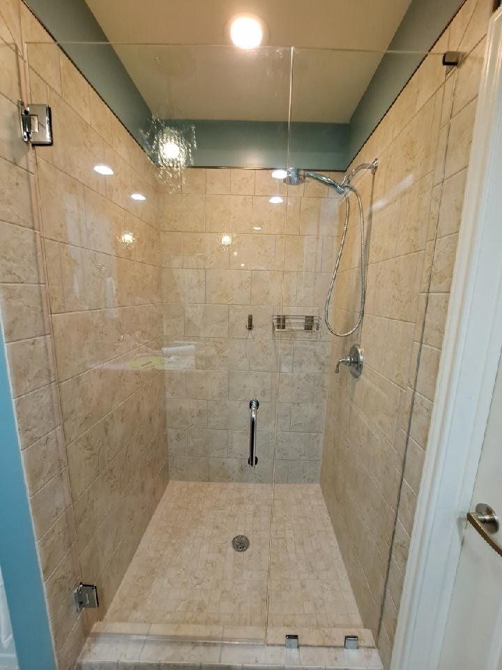 beige tile and glass shower