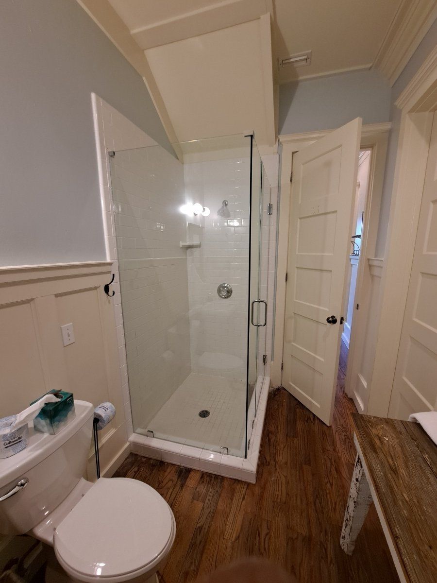 guest bath with glass shower enclosure
