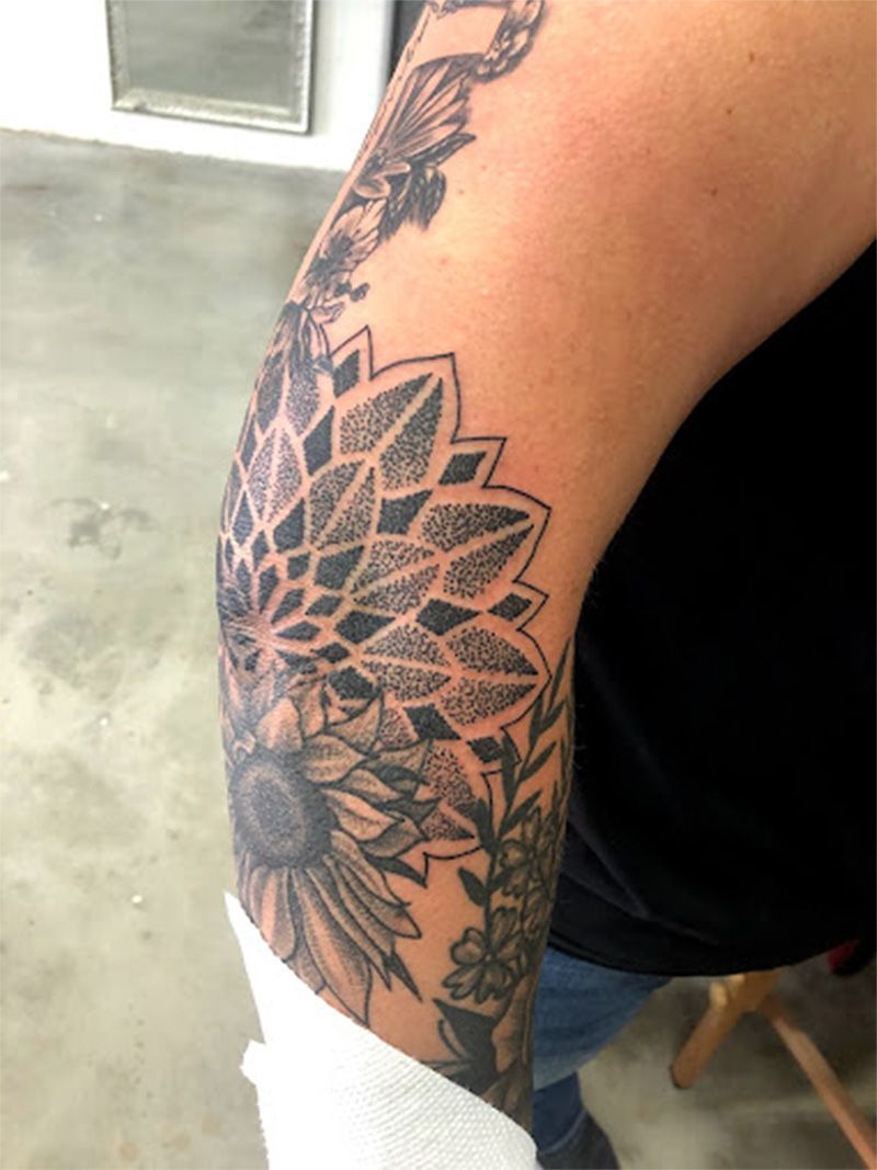 A close up of a person 's arm with a tattoo on it.