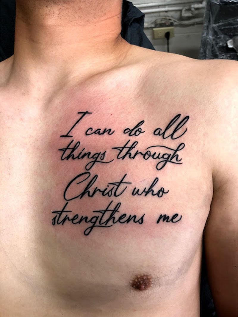 A man has a tattoo on his chest that says i can do all things through christ who strengthens me