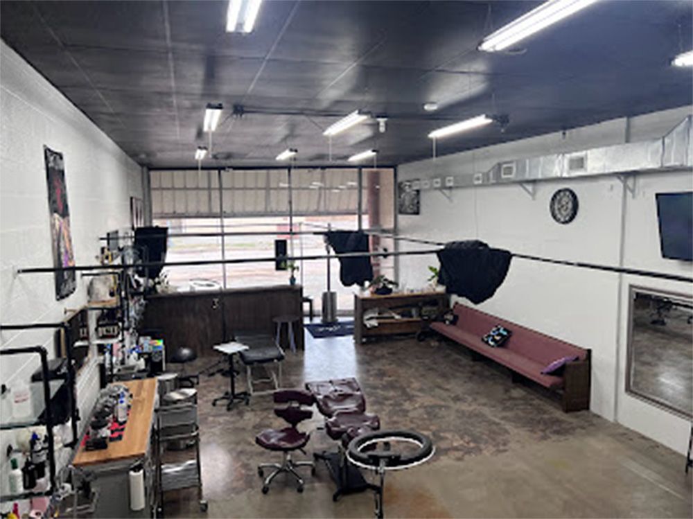 A large room with a lot of furniture and a lot of windows.