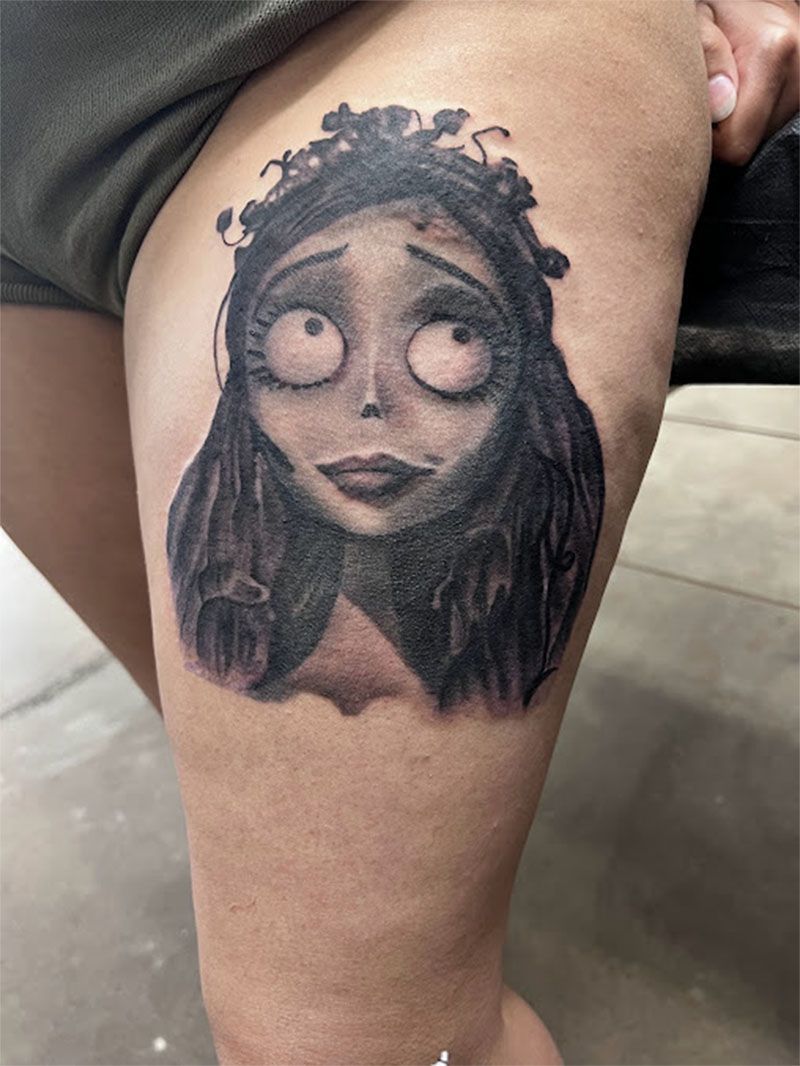A woman has a tattoo of a corpse bride on her leg.