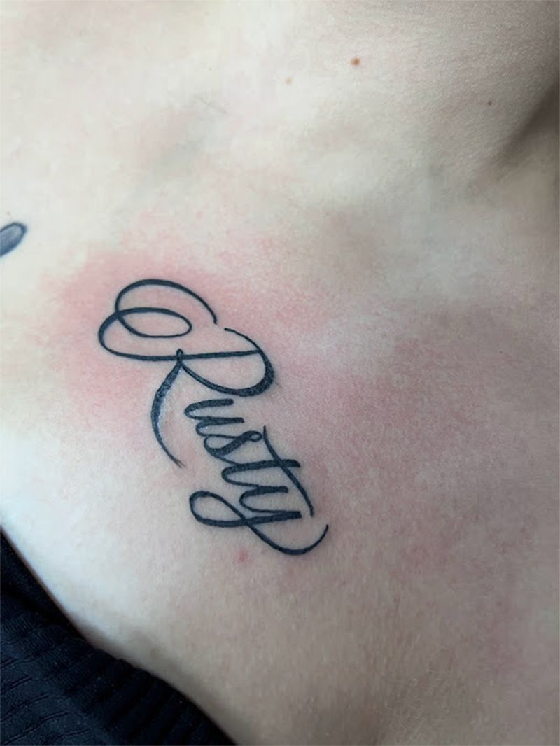 A person has a tattoo on their chest that says ruth