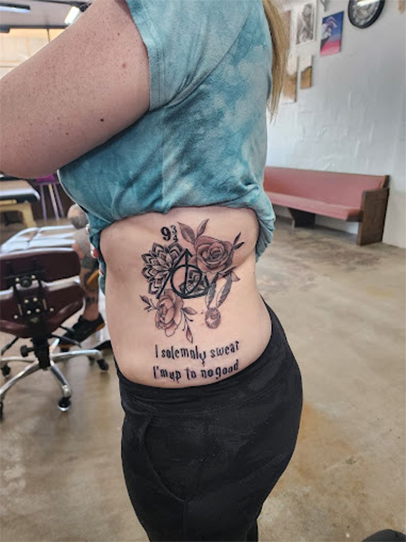 A woman is standing in a room with a tattoo on her side.