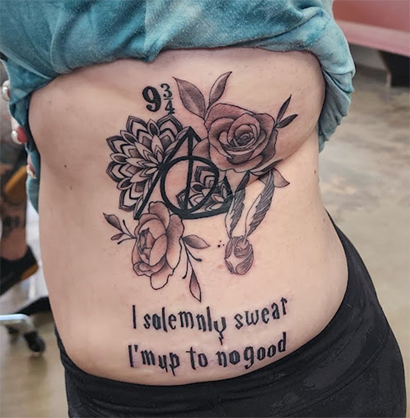 A woman has a tattoo on her back that says i solemnly swear i 'm up to no good