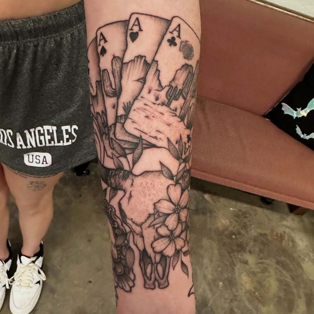 A person with a tattoo on their arm that says los angeles usa