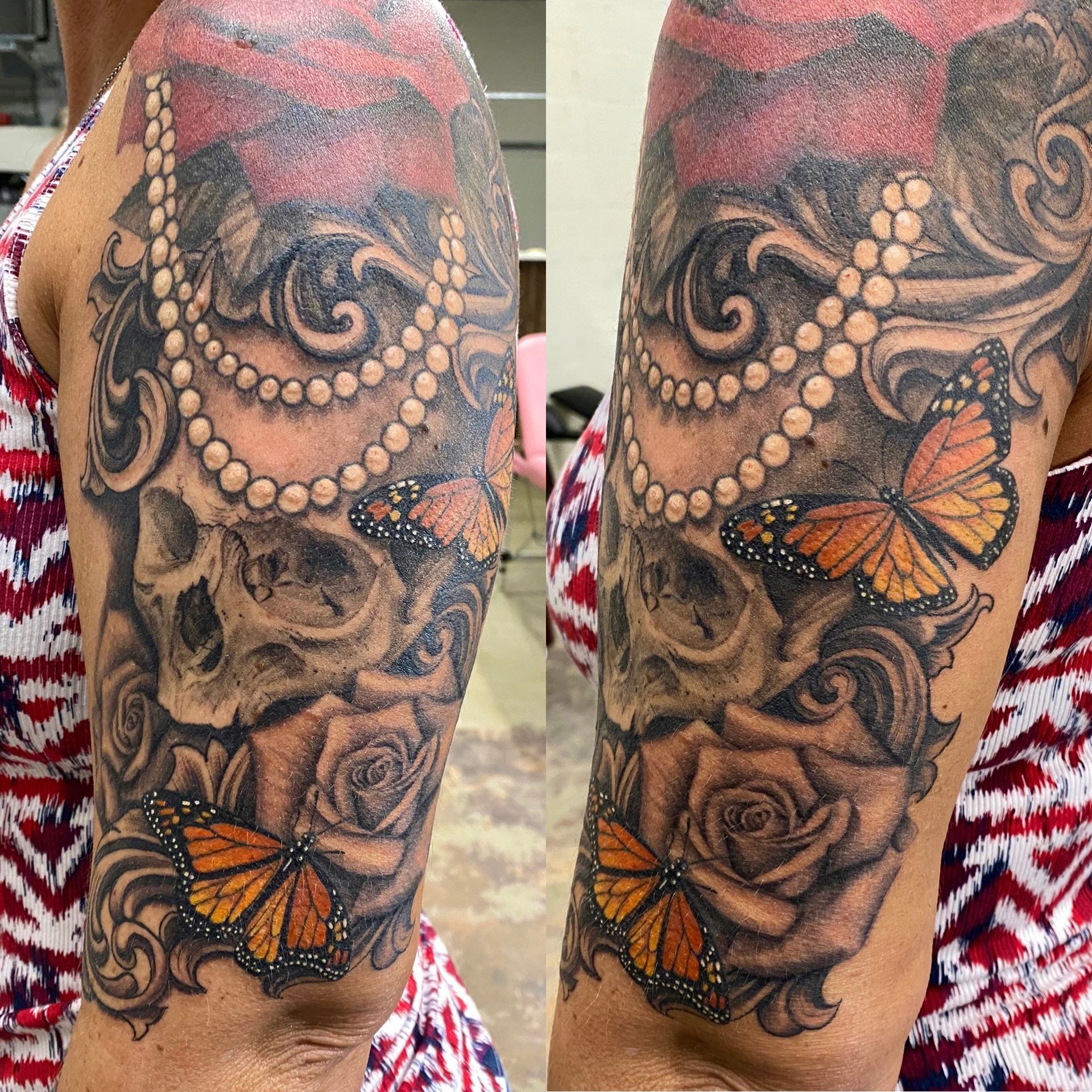 Tattoo on arm: skulls, roses, butterflies, pearl necklace, and ornate scrollwork.