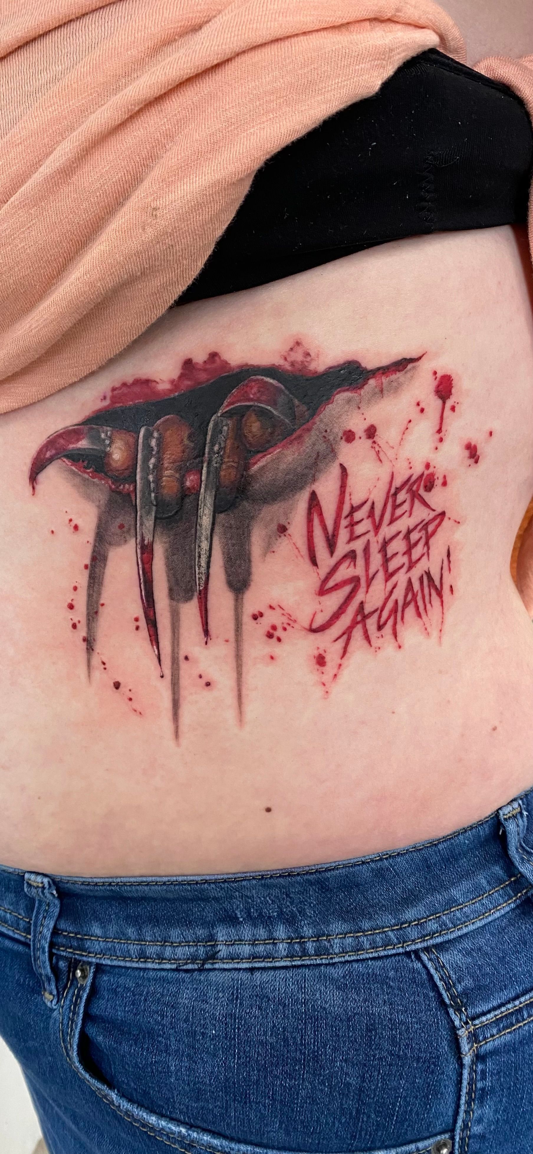 Tattoo of Freddy Krueger's claw with