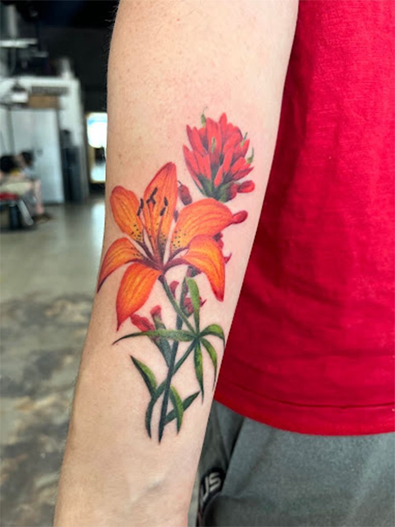 A person has a tattoo of flowers on their arm.