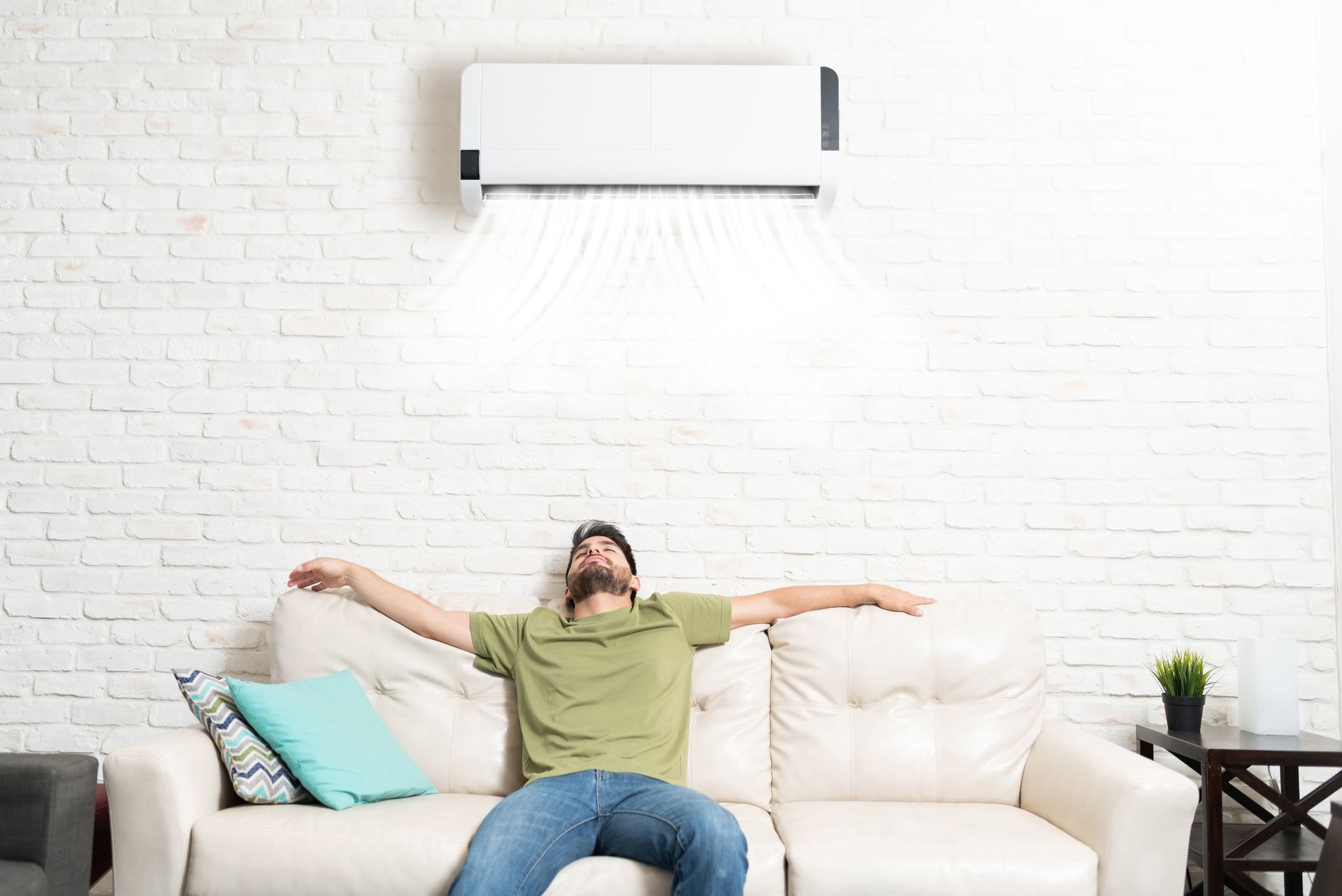 Man relaxing on couch showing improving indoor air quality for a Houston homeowner.