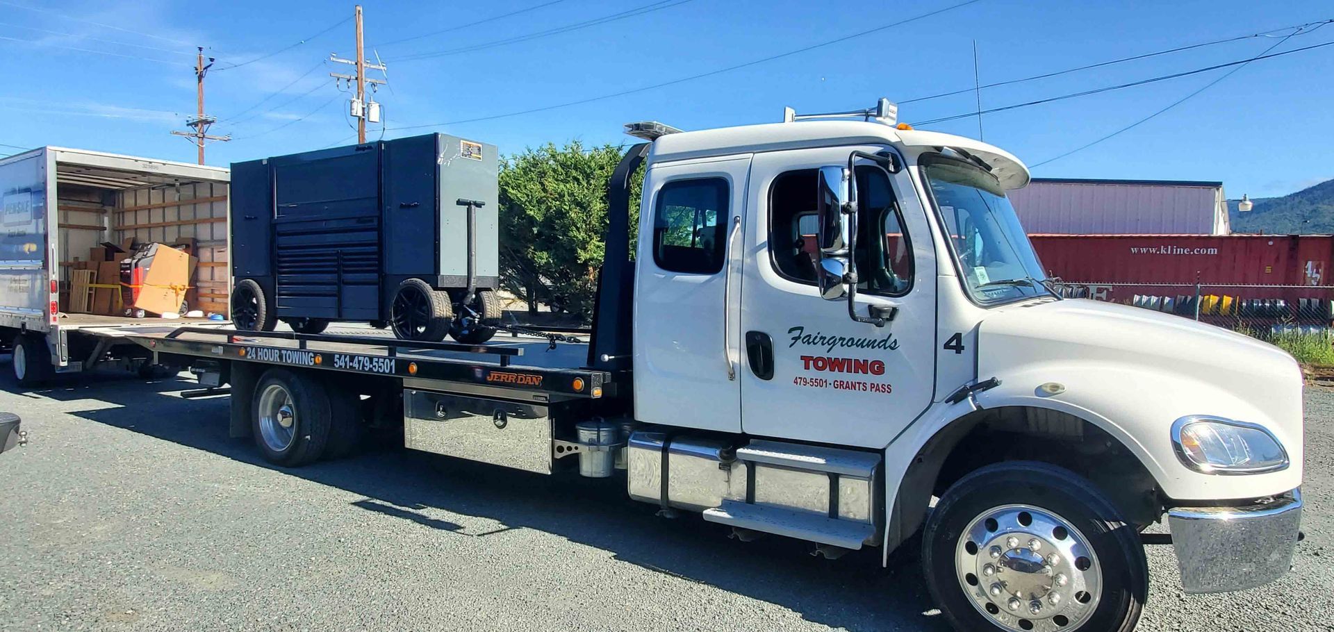 White Tow Truck Is Parked In A Gravel Lot — Grants Pass, OR — Fairgrounds Towing & Fuel LLC