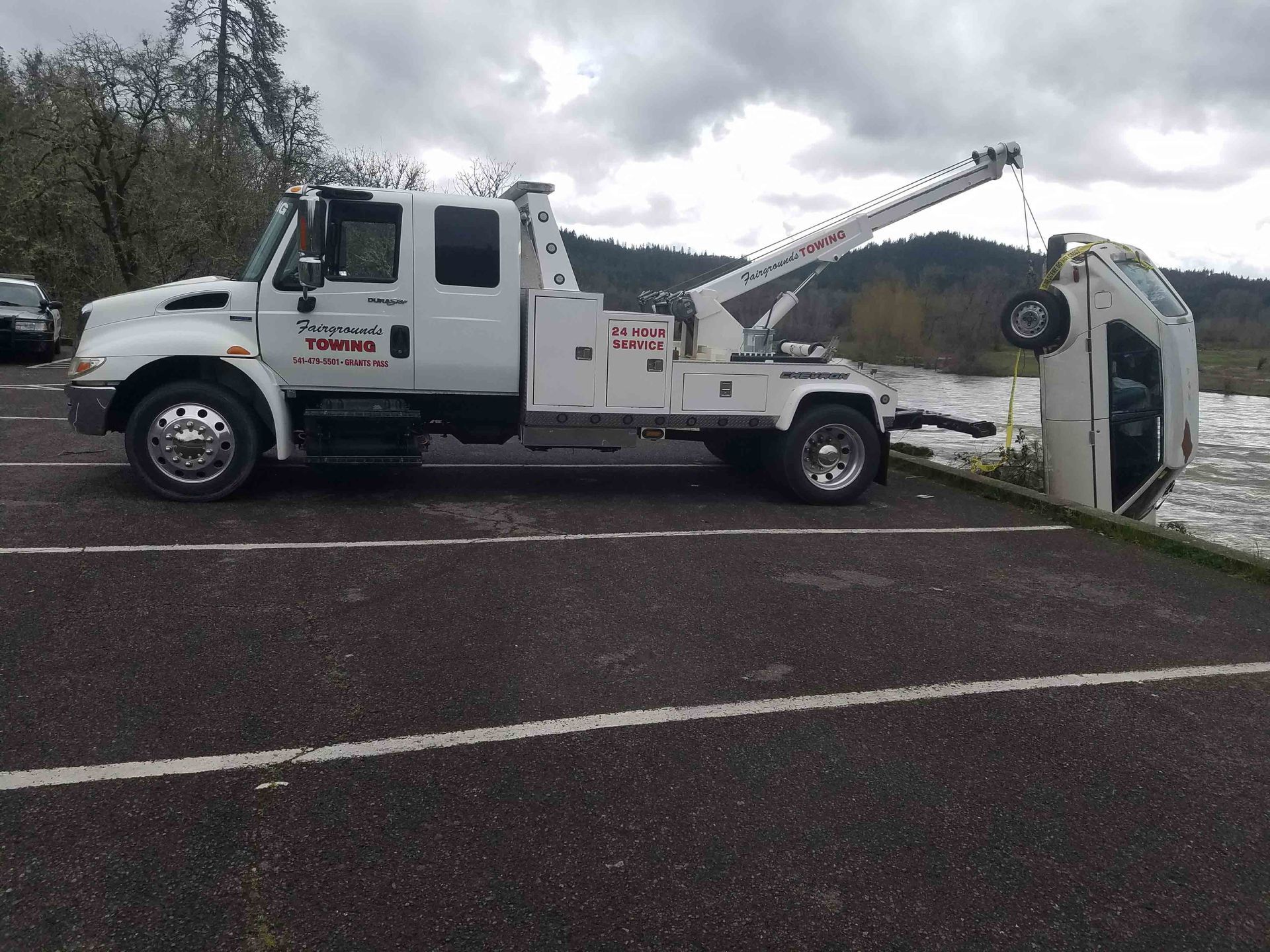 Midsection of Man Towing Trailer at Driveway — Grants Pass, OR — Fairgrounds Towing & Fuel LLC