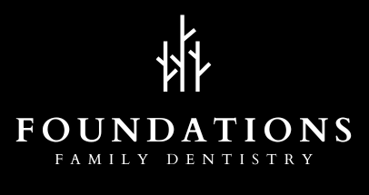 A black and white logo for foundations family dentistry | Top Dental Implants and Veneers in Tomball and Cypress TX