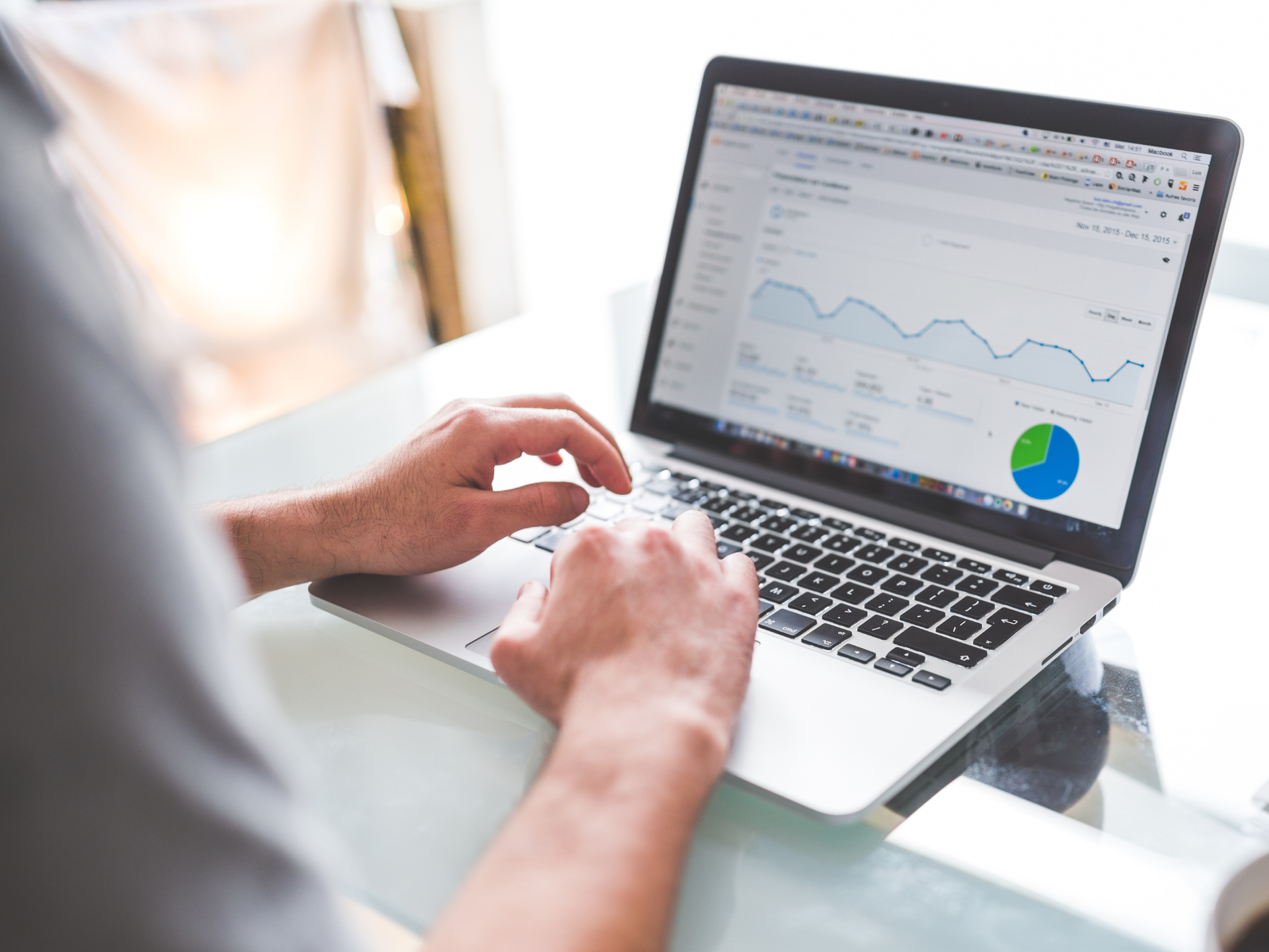 Laptop displaying a landscaping website, search bar reads 