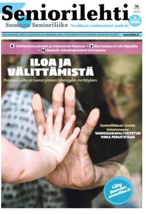 Seniorilehden kansi: Aikuisen käsi koskettaa lapsen kättä. Otsikko: 