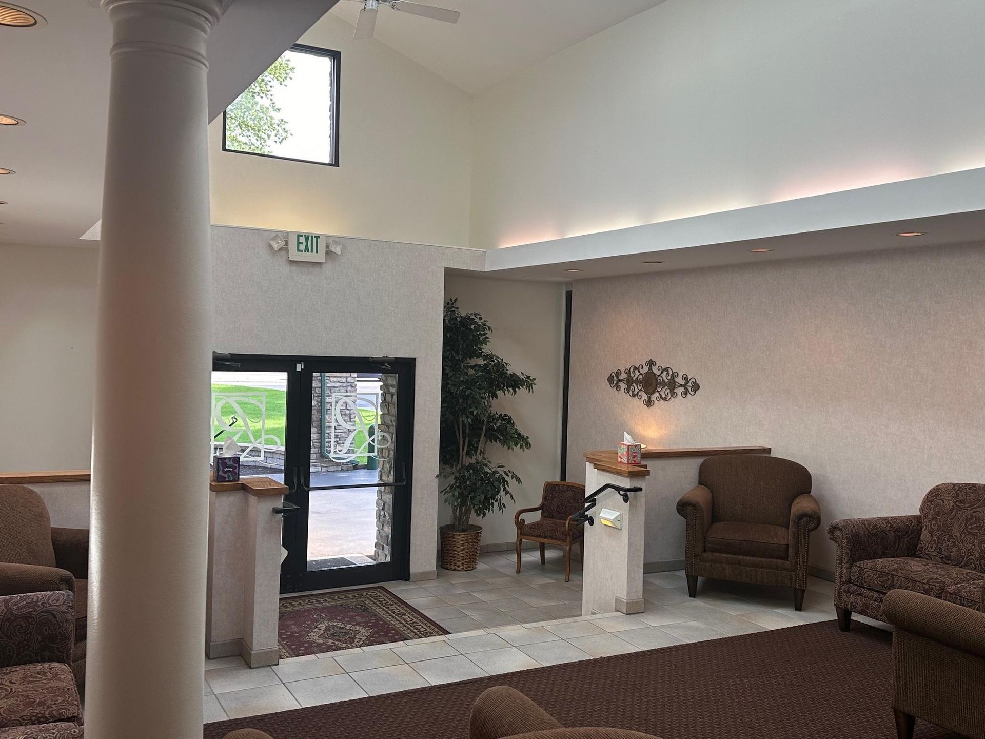Interior lobby with seating, entryway, and decorative accents.