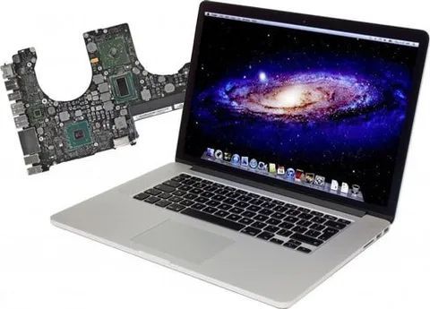 A Laptop With A Galaxy On The Screen Next To A Motherboard