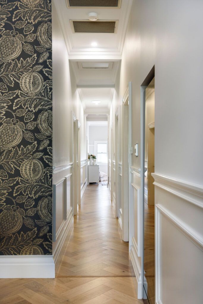 Elegant Wallpapered Wall Beside a Long Hallway — Custom Home Builders in the Hunter Valley