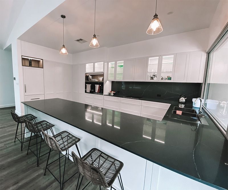 Large Kitchen With Hanging Lights — Custom Home Builders in the Hunter Valley