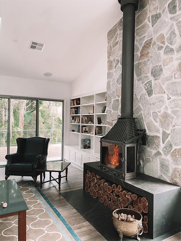 Cosy Living Room With a Fireplace — Custom Home Builders in the Hunter Valley
