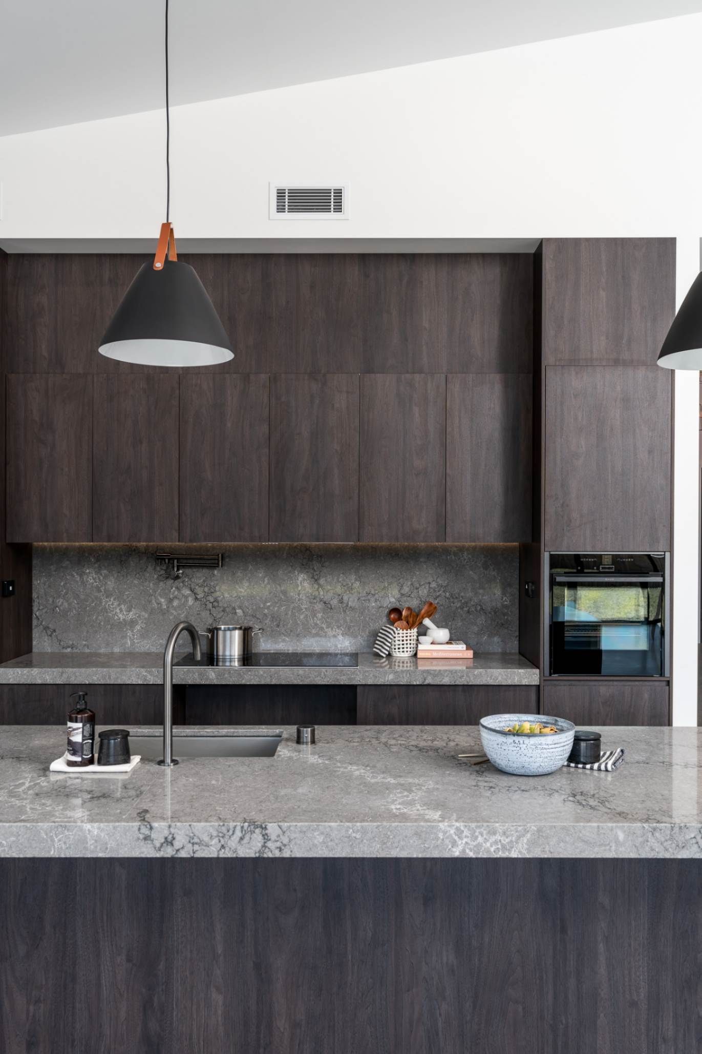 Kitchen With A Light Fixture Above The Countertop — Custom Home Builders in the Hunter Valley