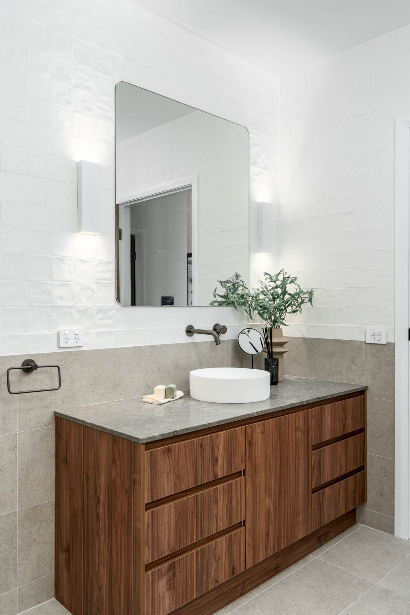 Bathroom With A Large Mirror — Custom Home Builders in the Hunter Valley