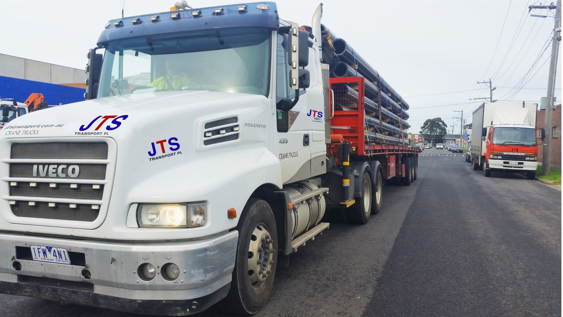 An image of semi truck is driving down a highway next to an image of a container truck.