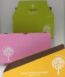 Three colorful Pumpkin Tree organic fruit boxes: green, pink, and yellow.