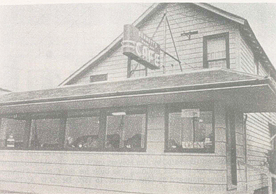 A two-story building with a sign that reads 