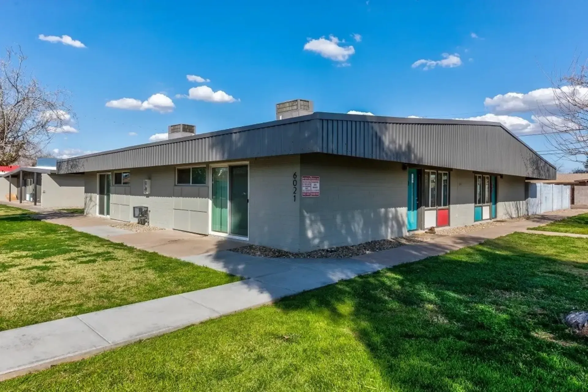 a building with a sign on the side that says no parking