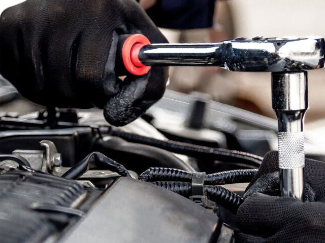 Auto repair on car engine | Garland Transmissions