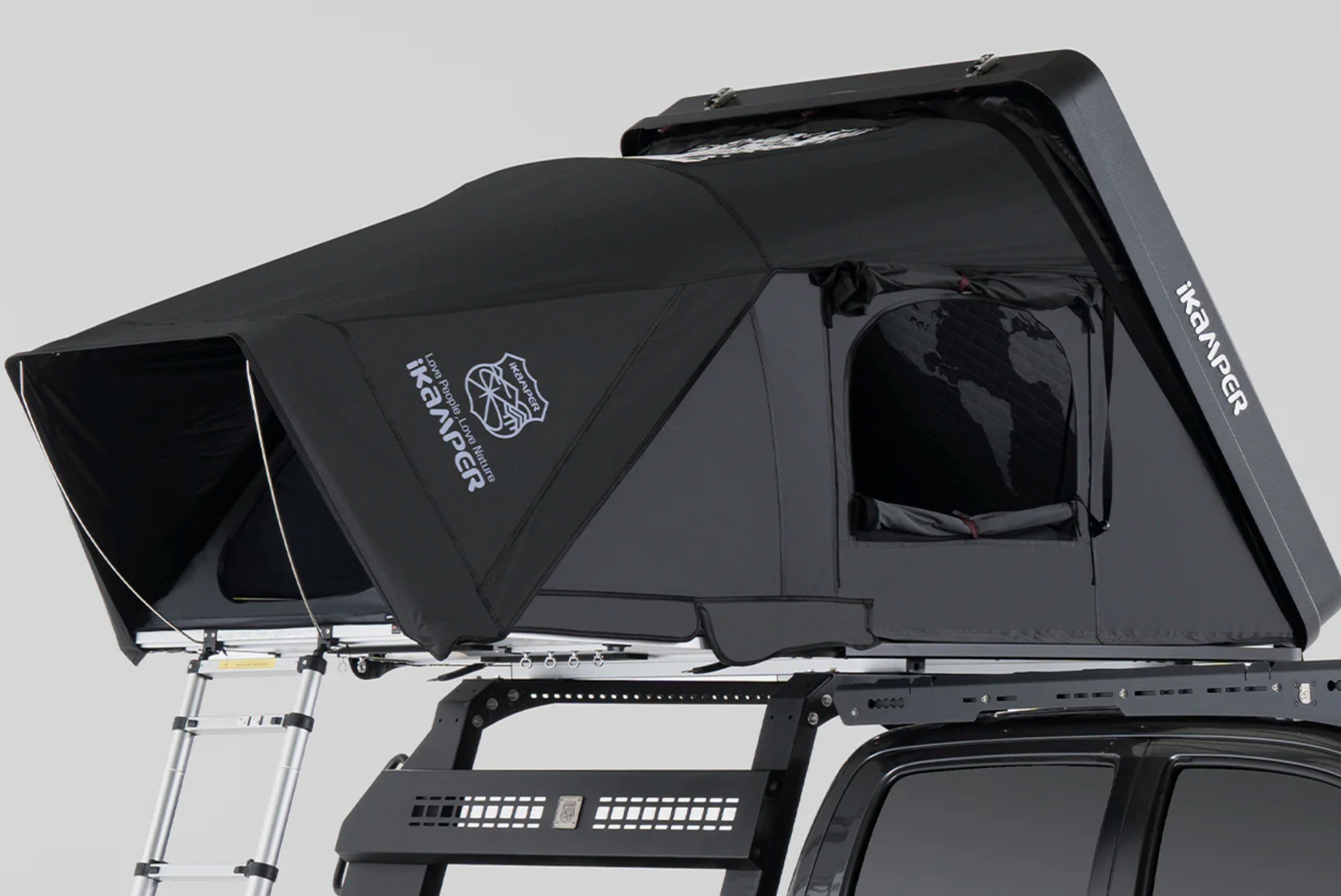 Black rooftop tent mounted on a vehicle with an attached ladder.