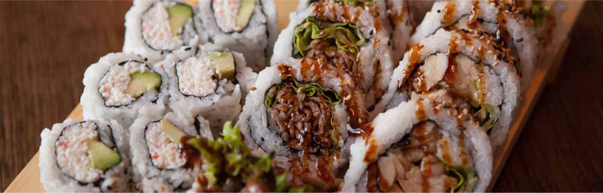 tray of various sushi rolls