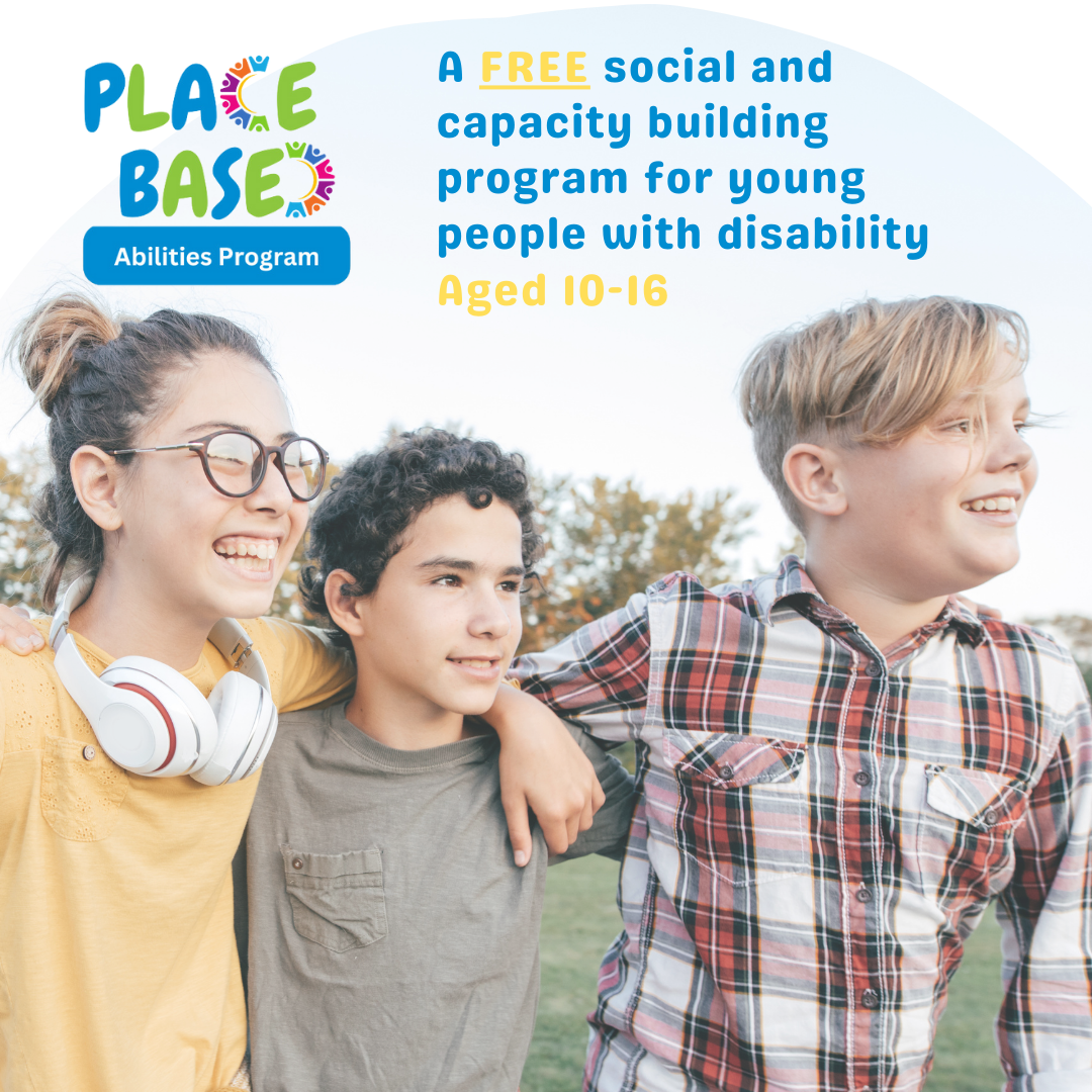 Three young people standing together looking happy.