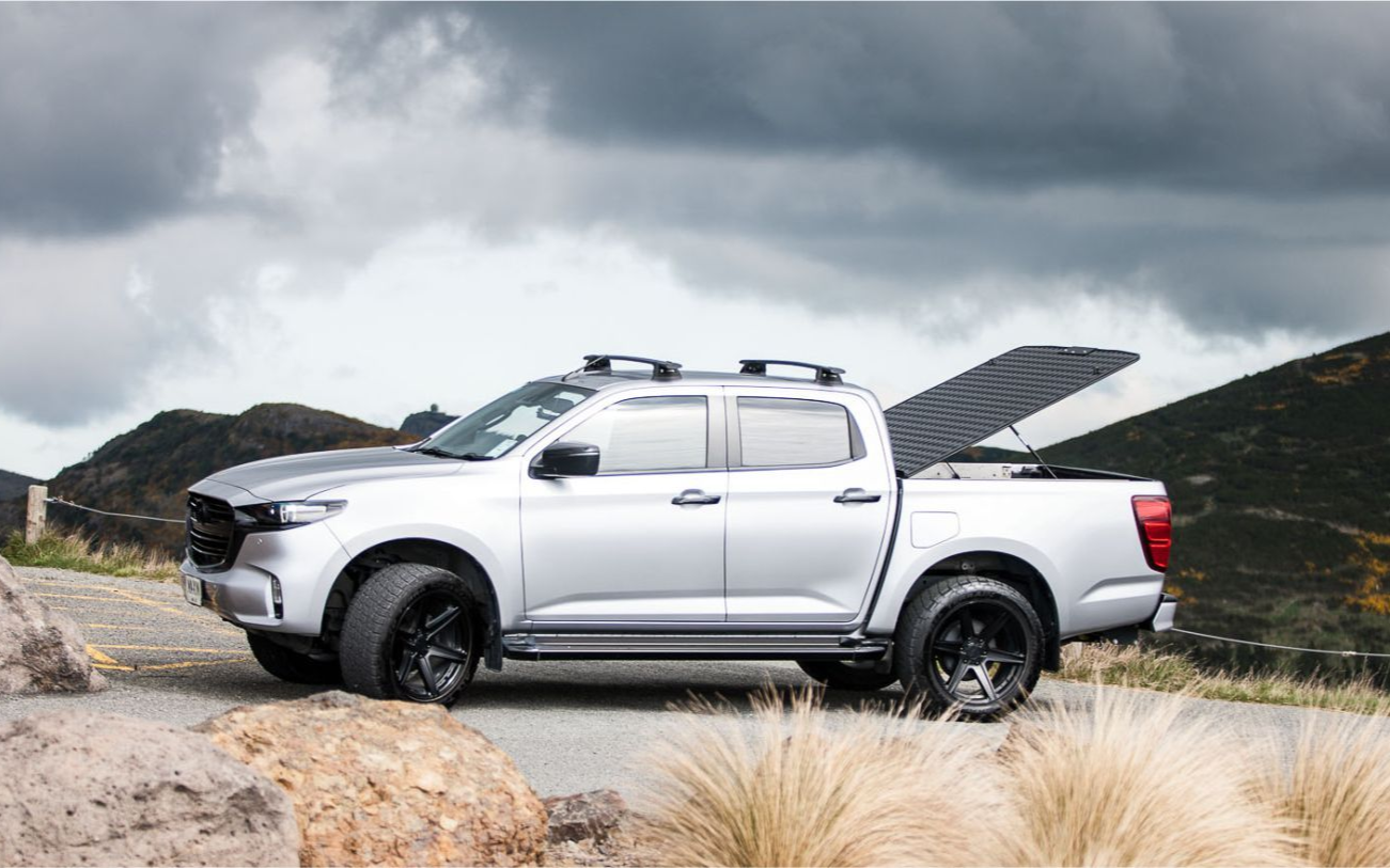 MAZDA BT-50 with MAXIM Hard Lid off road on a mountain