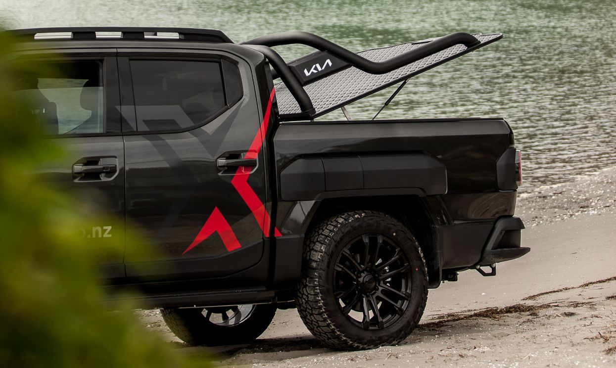 Kia Tasman with MAXIM Sports Hard Lid open on the beach.