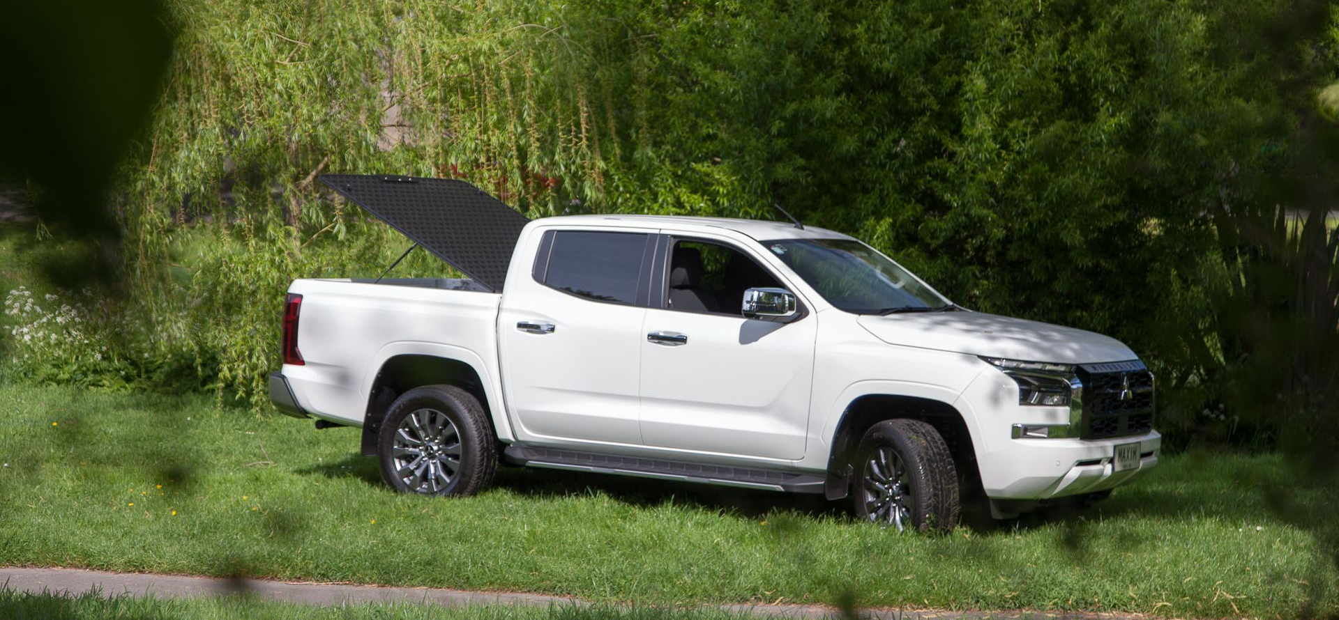 Mitsubishi Triton with MAXIM Hard Lid in the outdoors.