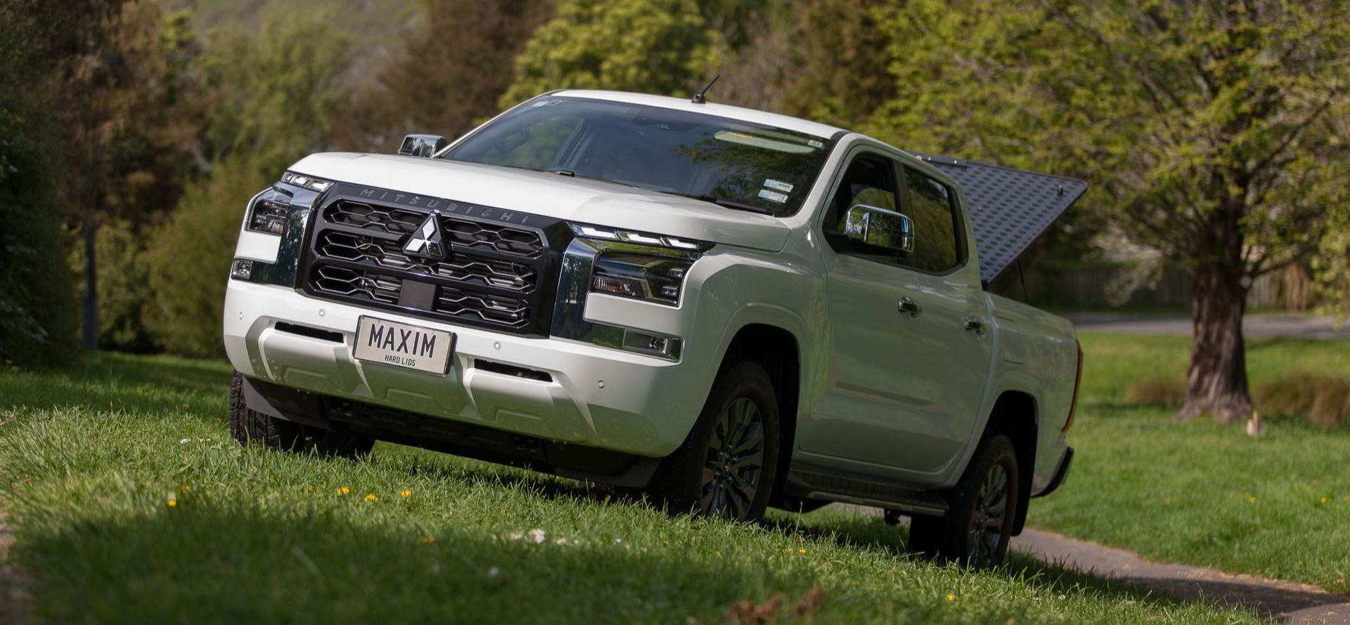 Mitsubishi Triton with MAXIM Hard Lid in the outdoors.