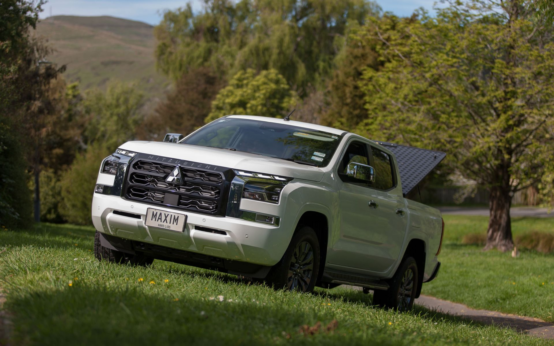 Mitsubishi Triton with MAXIM Hard Lid on a country road