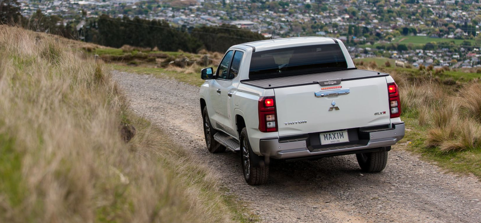 Mitsubishi Triton with MAXIM Hard Lid in the outdoors.