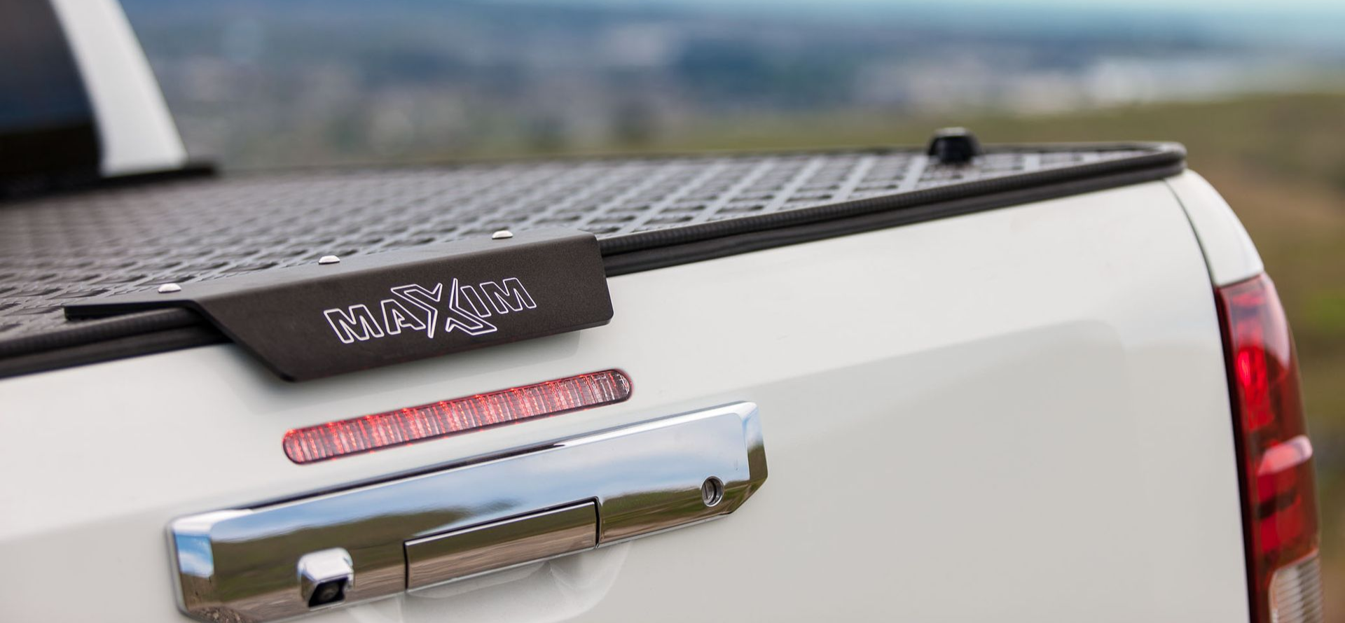 Mitsubishi Triton with MAXIM Hard Lid in the outdoors.