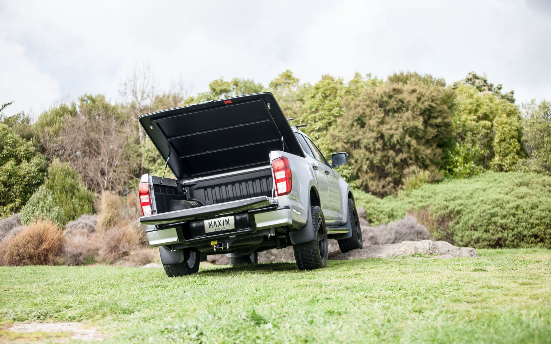 MAZDA BT-50 with MAXIM Hard Lid off road on a mountain